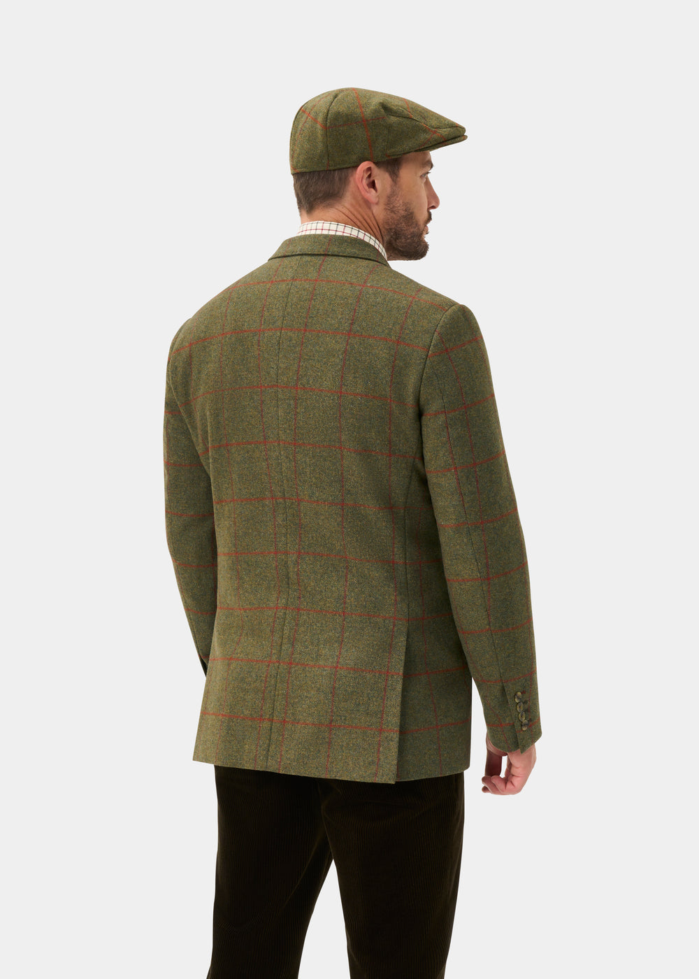 Man in a Combrook Men’s Tweed Sports Blazer in Reed, seen from behind against a plain white background.