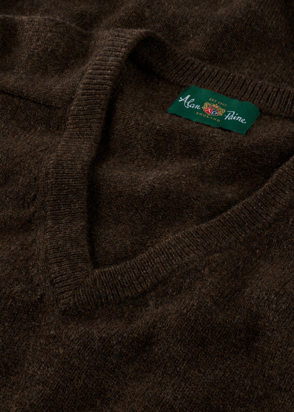 Kilsyth Lambswool Vee Neck Jumper in Cocoa with green Alan Paine collar label; classic regular fit style.