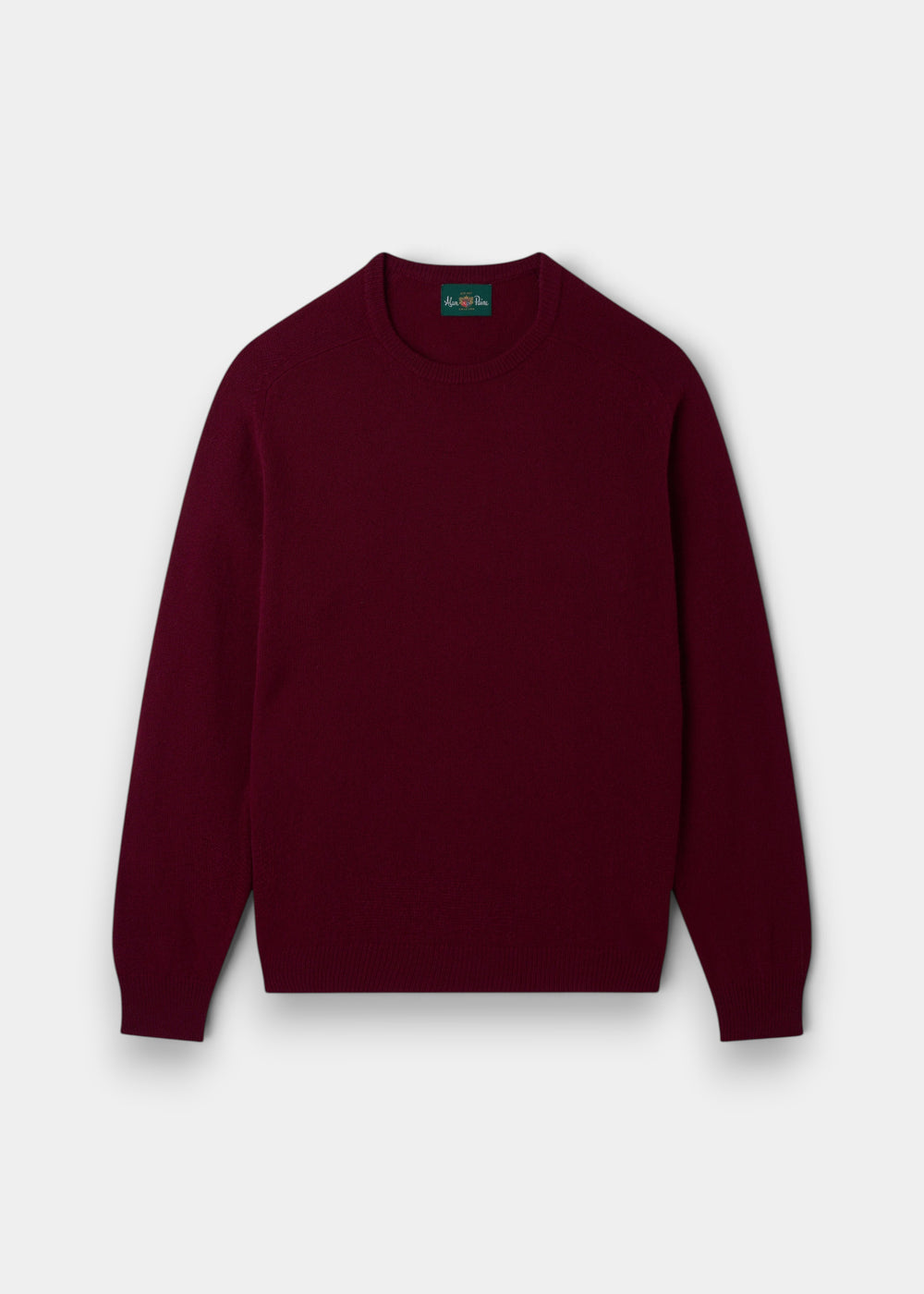 The Dorset Lambswool Crew Neck Jumper in Bordeaux - Classic Fit laid flat on a white background.