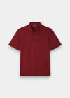 Alan Paine cherry red luxury polo shirt in a soft blend of Pima cotton, silk, and cashmere with a ribbed hem.