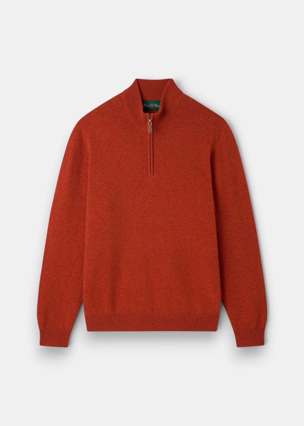 Sutherland Lambswool Quarter Zip Jumper In Ember, a rust-colored quarter-zip sweater with a high collar and ribbed cuffs.