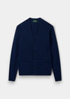 Alan Paine Cornwall indigo lambswool cardigan with a V-neck, five-button front, and two jetted pockets.