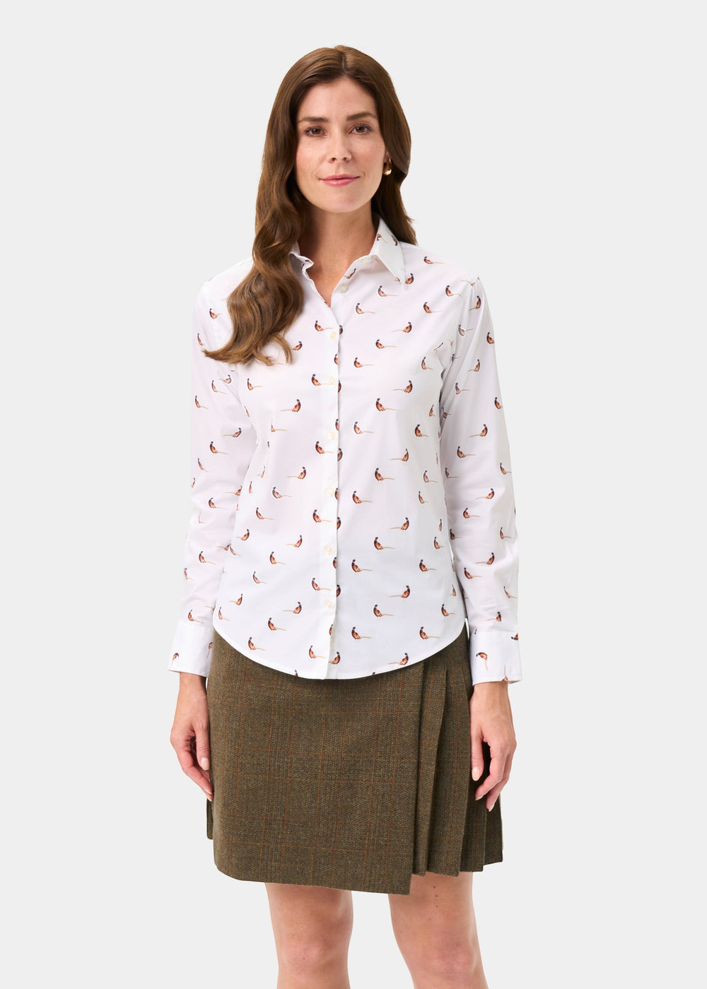 Woman wears Lawen Cotton Printed Shirt in pheasant design with a brown pleated skirt, against a plain background.