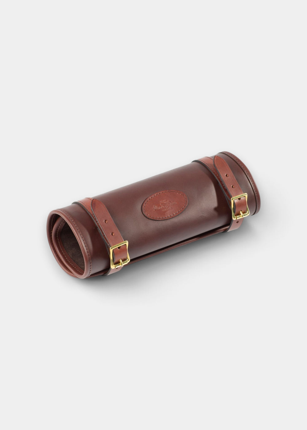 Alan Paine brown heavy duty harness leather cleaning roll with antique brass buckles and embossed logo detail.