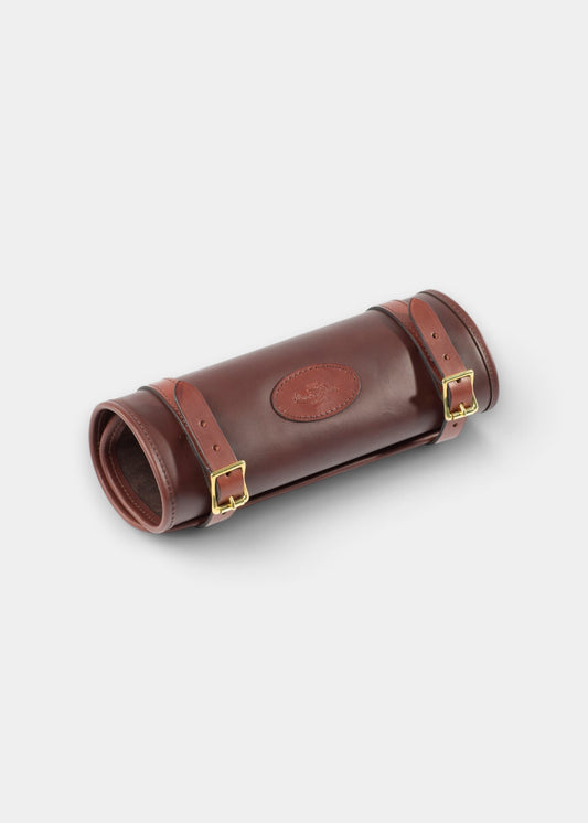 Alan Paine brown heavy duty harness leather cleaning roll with antique brass buckles and embossed logo detail.