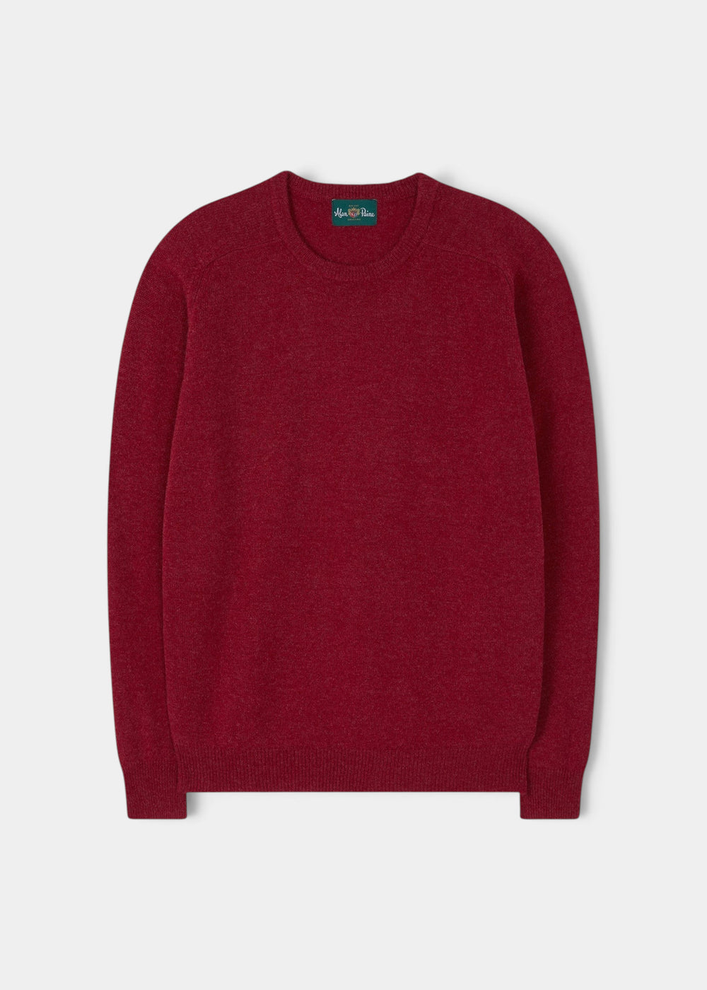 The Lenzie Lambswool Crew Neck Jumper in Poppy is laid flat on a white background.