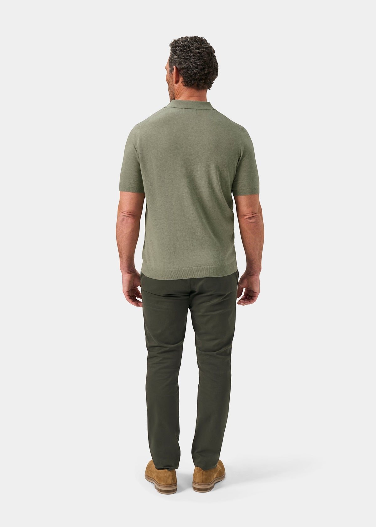 Alan Paine Shipford men's short sleeve polo shirt in landscape green wool-linen-silk blend, back view on a model.