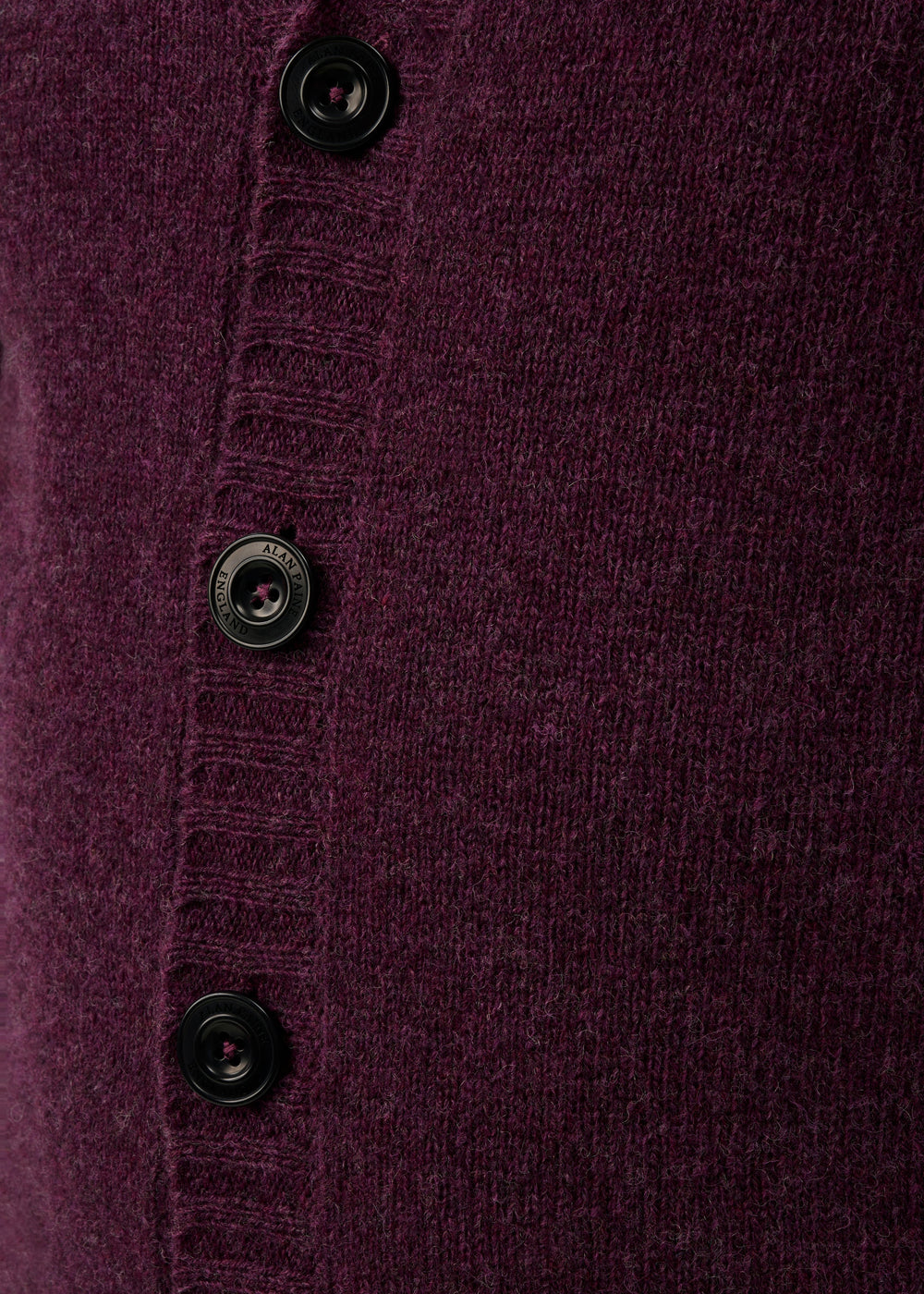 Close-up of the Kinloch Supersoft Shetland Wool V-Neck Cardigan in Elderberry with a ribbed four-button placket.