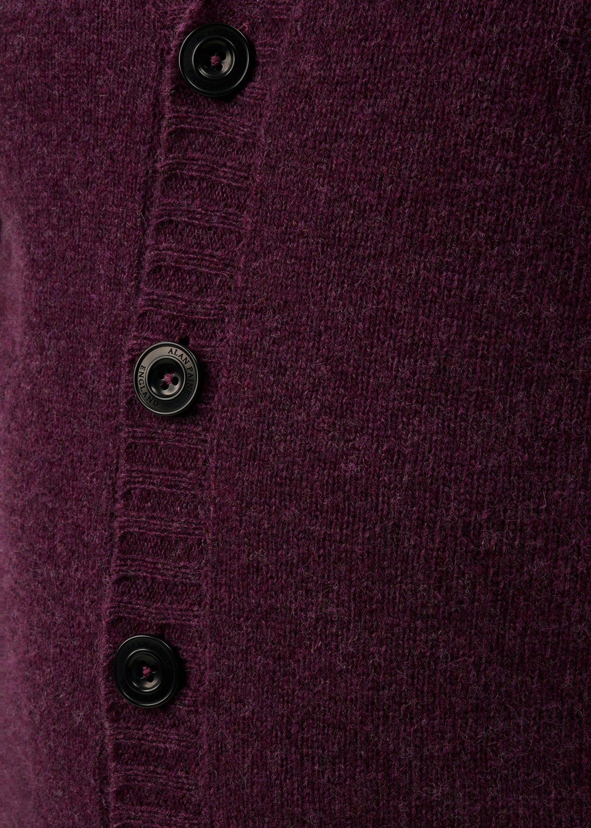 Close-up of the Kinloch Supersoft Shetland Wool V-Neck Cardigan in Elderberry with a ribbed four-button placket.