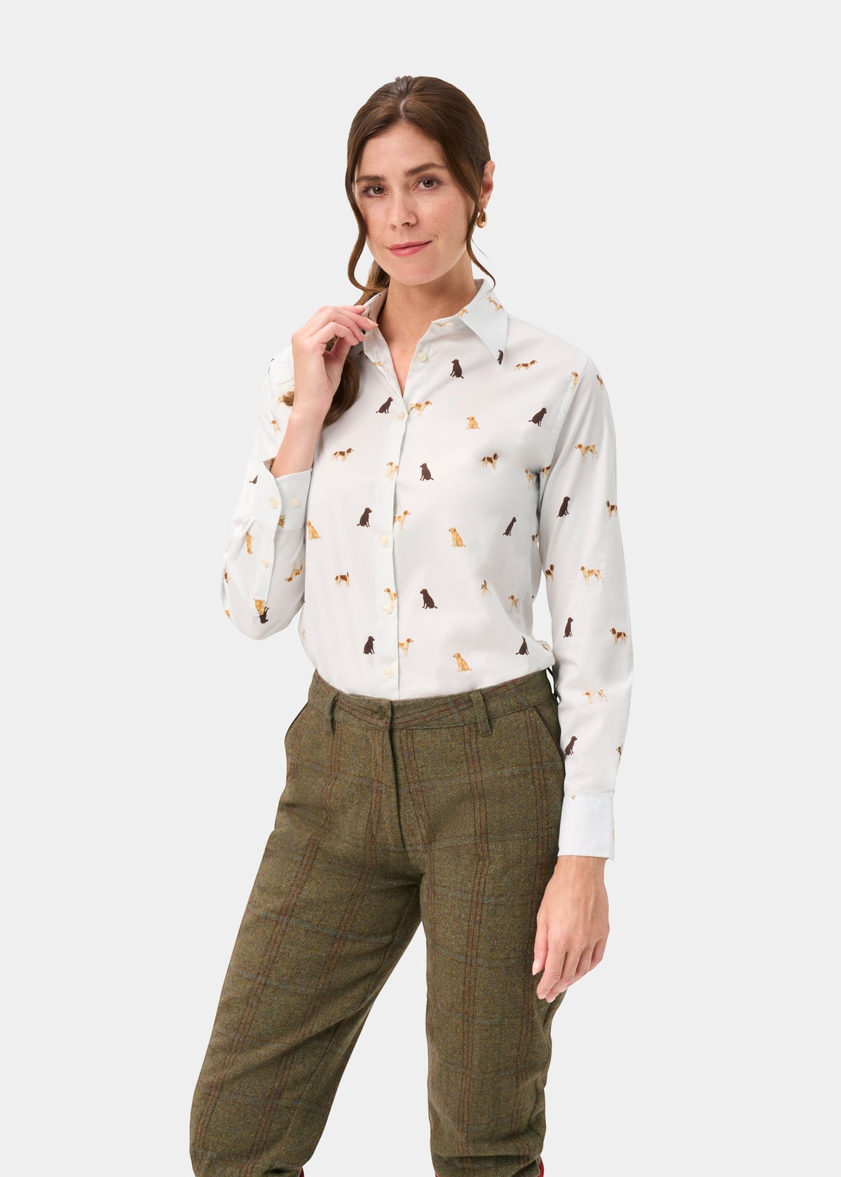 Woman in a Lawen Ladies Gun Dog Print cotton shirt, feminine fit, paired with brown plaid pants.