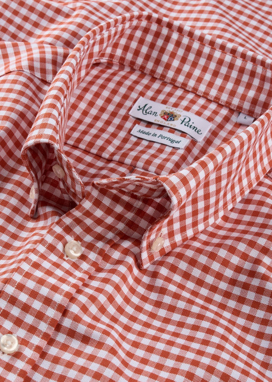Close-up of red and white checkered classic fit shirt, cotton fabric, button front, made in Portugal.