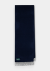 Risbury Men’s Cashmere Plain Scarf In Navy with a fringed edge and a small brand label at the corner.