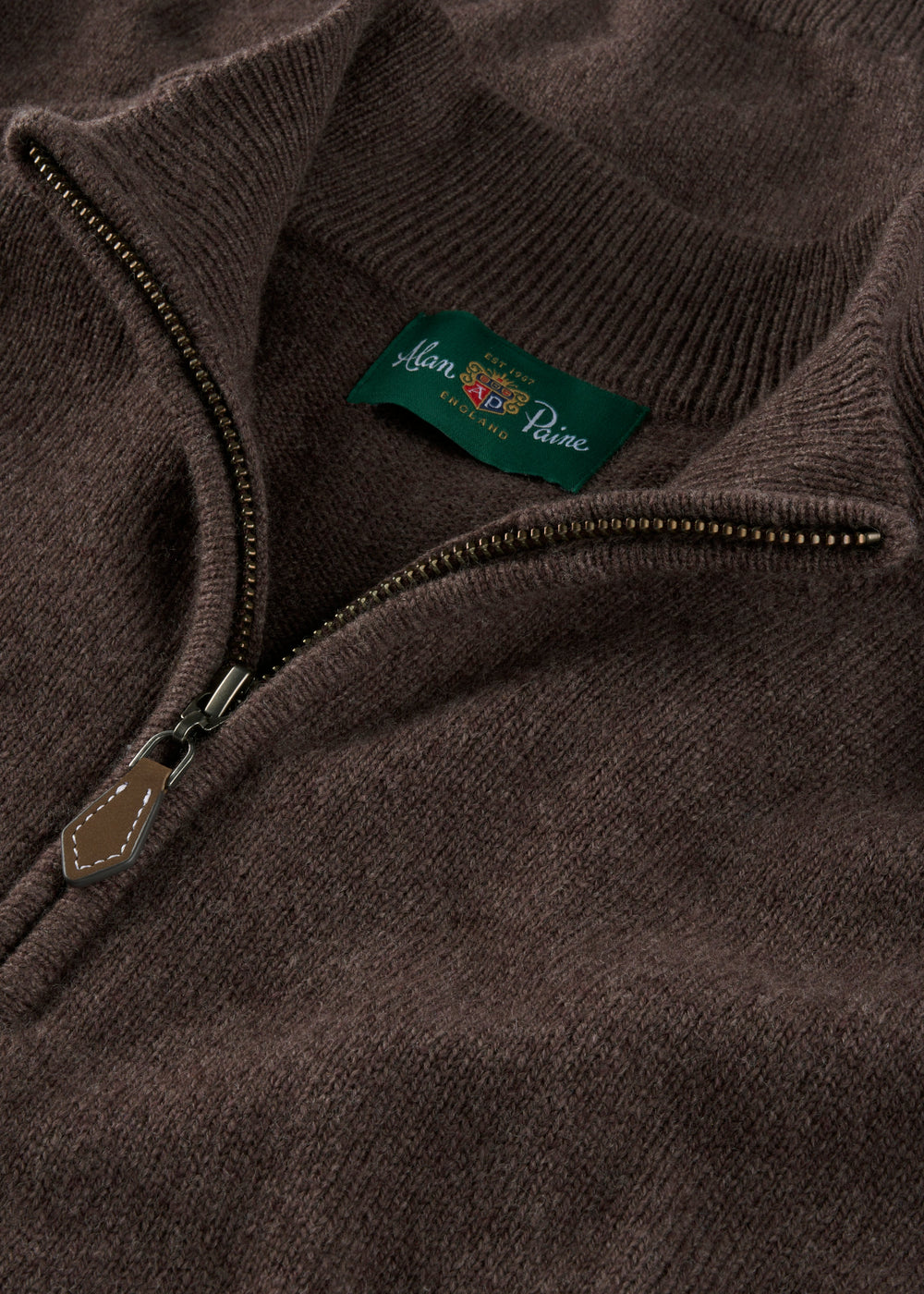 Sutherland Lambswool Quarter Zip Jumper in mocha with a branded green label at the neckline.