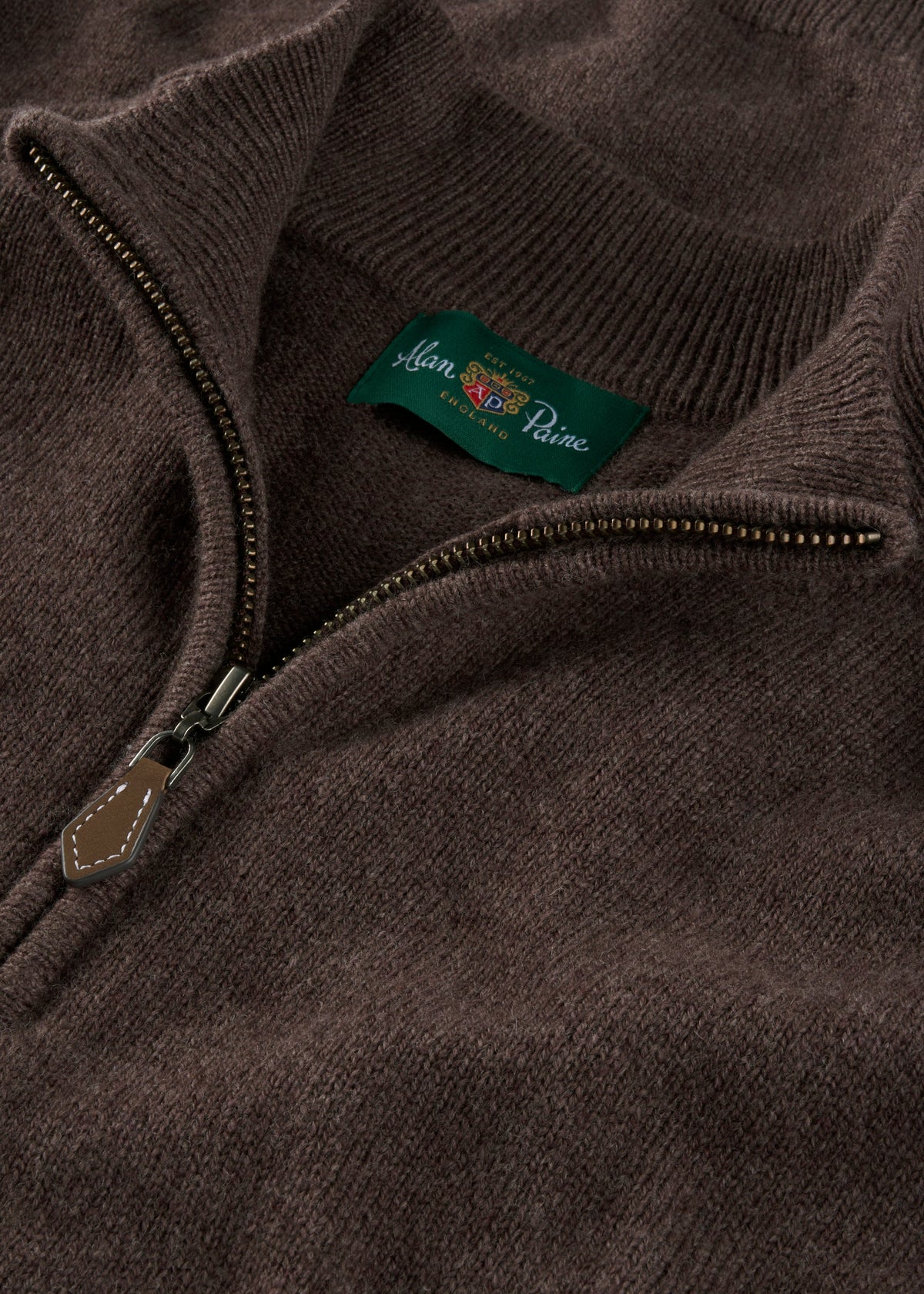 Sutherland Lambswool Quarter Zip Jumper in mocha with a branded green label at the neckline.